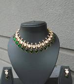 Kundan necklace set with green semiprecious stones