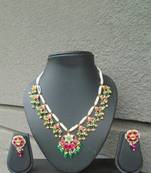 Jadau pink and green necklace set with pearl drops