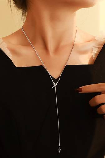 Silver plated tassel knot necklace