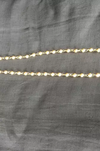 golden alloy necklace chain with traditional pearl work