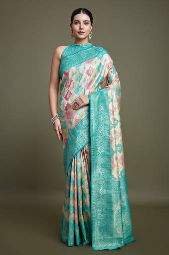 Glamour And Tradition With This Zari Woven Turquoise And Cream Banarasi silk blend Saree