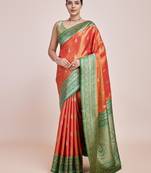 Glamour And Tradition With This Zari Woven Faux Banarasi Tissue Silk Orange Saree