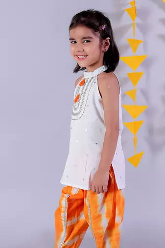 white girls cotton kurta and orange dhoti ethnic set
