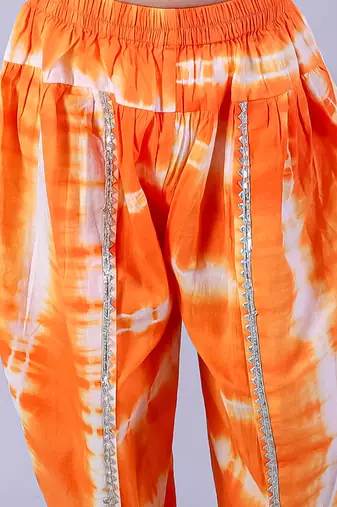 white girls cotton kurta and orange dhoti ethnic set