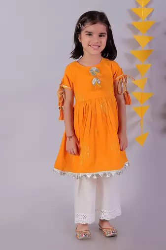 orange cotton kurta and white pyjama ethnic set