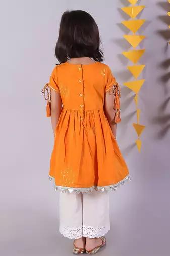 orange cotton kurta and white pyjama ethnic set