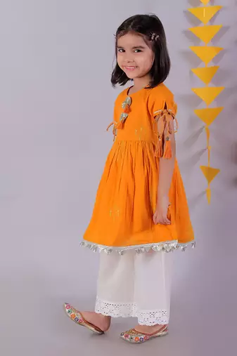 orange cotton kurta and white pyjama ethnic set
