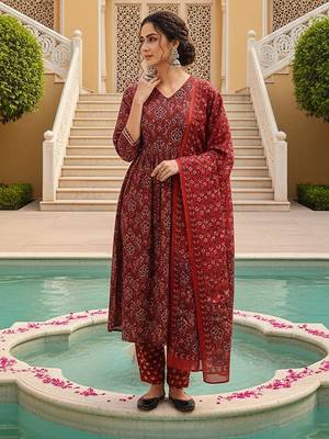 Women Red color cotton blend printed fancy flared kurta trousers with dupata 1