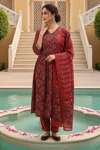 Women Red color cotton blend printed fancy flared kurta trousers with dupata