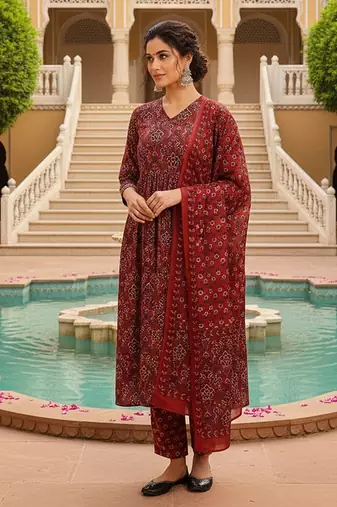 Women Red color cotton blend printed fancy flared kurta trousers with dupata