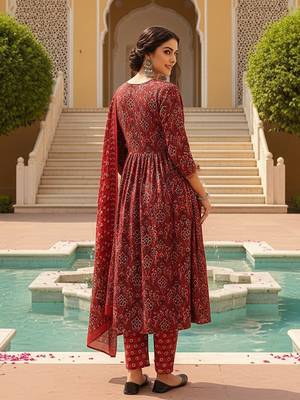 Women Red color cotton blend printed fancy flared kurta trousers with dupata 5
