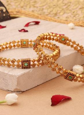 Whimsical Elegance: Gold-Plated Bangles with Delicate Shapes and Floral Accents 4
