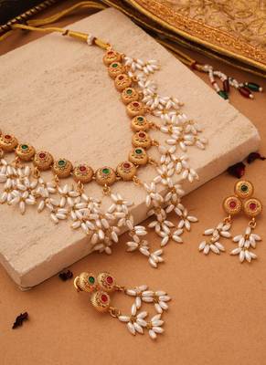 Radiant Reverie: Gold Cup Necklace with Red Stones and White Oval Jhumkis 2