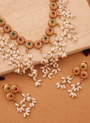 Radiant Reverie: Gold Cup Necklace with Red Stones and White Oval Jhumkis 3