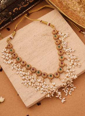 Radiant Reverie: Gold Cup Necklace with Red Stones and White Oval Jhumkis 4