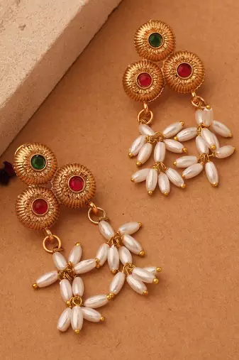 Radiant Reverie: Gold Cup Necklace with Red Stones and White Oval Jhumkis