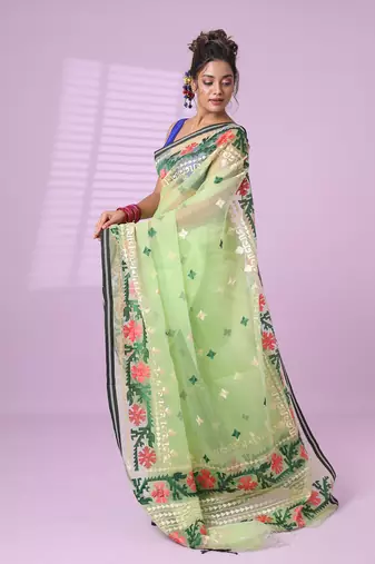 Pistachio green muslin soft saree with embroidered work