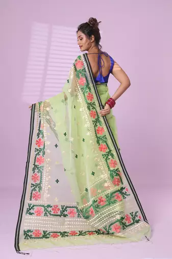 Pistachio green muslin soft saree with embroidered work