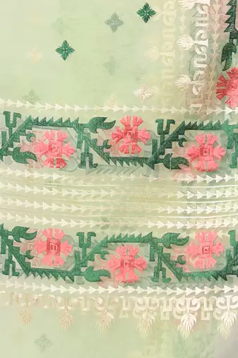Pistachio green muslin soft saree with embroidered work