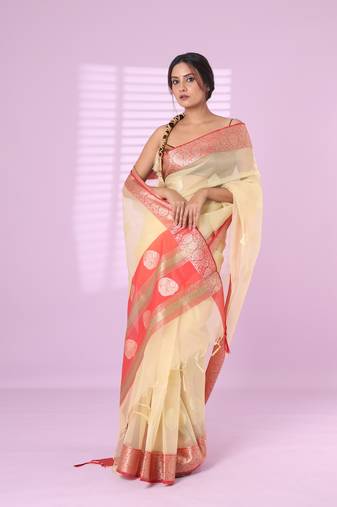 Beige organza saree with zari weave border