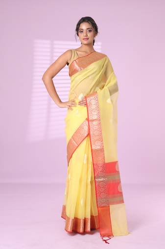 Yellow organza saree with zari weave border