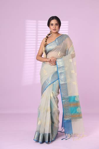 Ecru organza saree with zari weave border