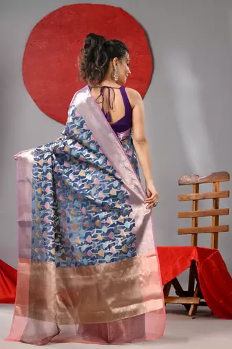 Blue organza saree with  allover multicolor flower