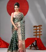 Dark green organza saree with  allover multicolor flower