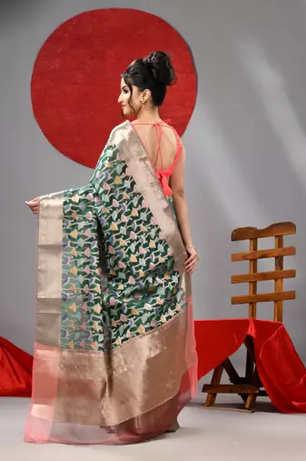 Dark green organza saree with  allover multicolor flower