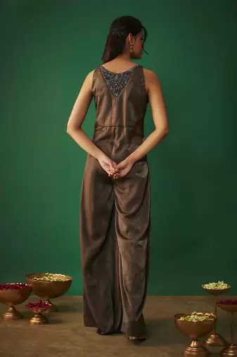 Grey flared jumpsuit with embroidered neck