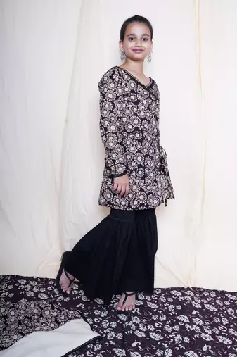 Black bagru handblock printed full sleeves angrakha kurta embellished with crochet lace , paired with black sharara