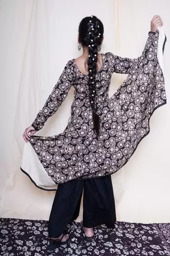 Black bagru handblock printed full sleeves angrakha kurta embellished with crochet lace , paired with black sharara
