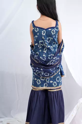 Indigo handblock printed sleeveless short kurta, paired with indigo sharara