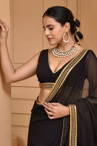 Black lace embellished georgette saree with blouse