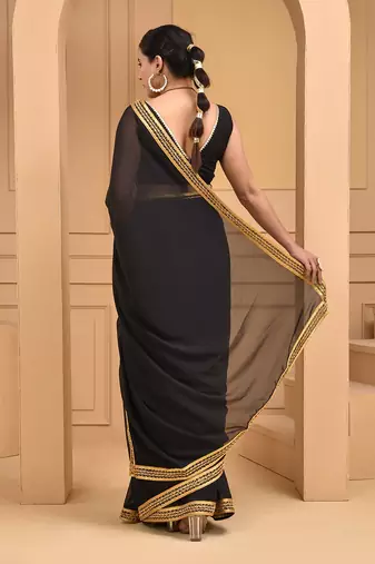 Black lace embellished georgette saree with blouse