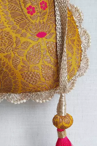 Mustard kashi yellow banarasi silk potli bag