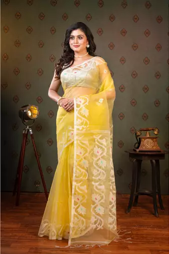 Light yellow  muslin saree offwhite woven motifs with running blouse piece