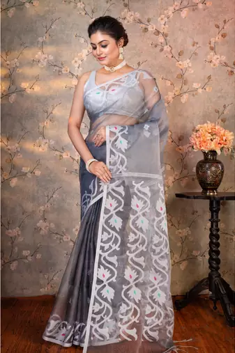 Grey  muslin saree offwhite woven motifs with running blouse piece