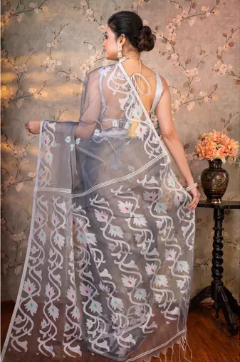 Grey  muslin saree offwhite woven motifs with running blouse piece