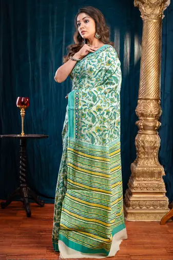 Green  bagru malmal cotton saree with multicolor floral motifswith running blouse piece