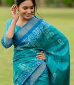 Turquoise silk blend paisley block print golden zari border saree