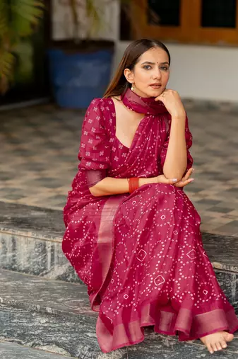 Rani pink silk blend bandhani print block print golden zari border saree