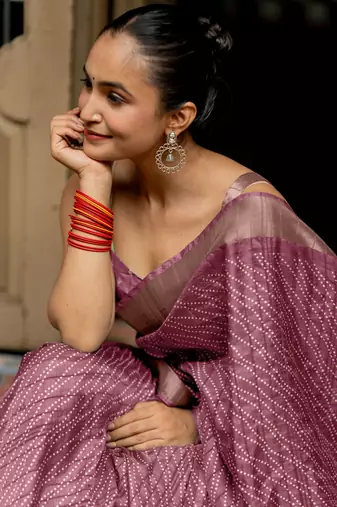 Dusty pink silk blend polka dots stripes print golden zari border saree