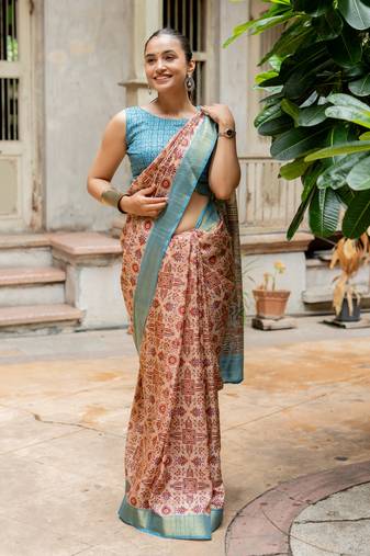 Light peach silk blend ajrakh print golden zari border saree