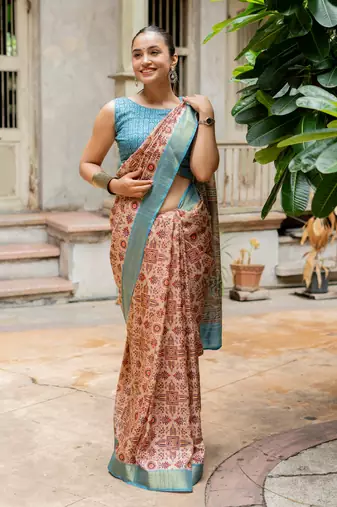 Light peach silk blend ajrakh print golden zari border saree