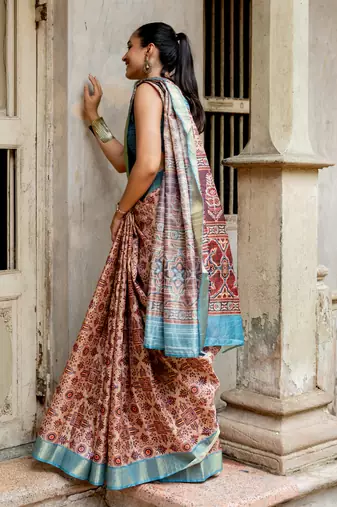 Light peach silk blend ajrakh print golden zari border saree
