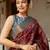 Maroon silk blend ajrakh print golden zari border saree