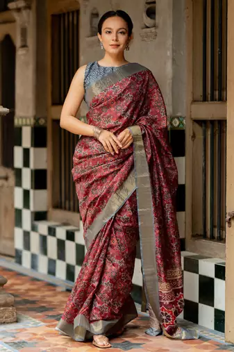 Maroon silk blend ajrakh print golden zari border saree