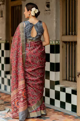 Maroon silk blend ajrakh print golden zari border saree