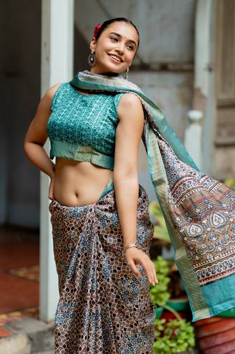 Taupe silk blend geometric print golden zari border saree